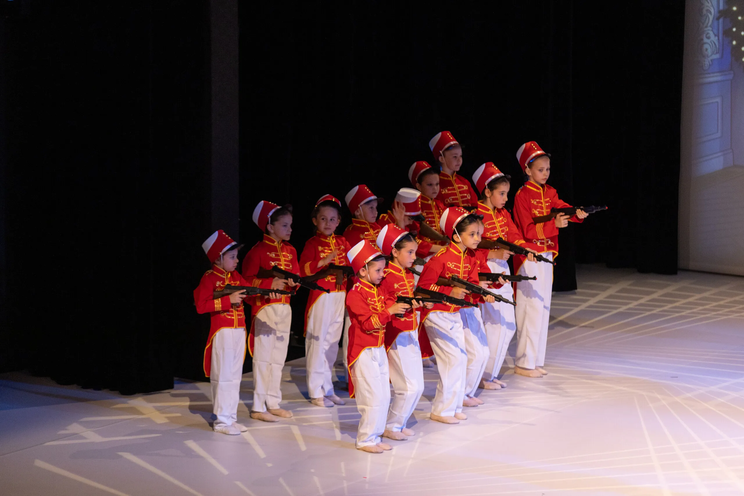 The soldiers in red and white, in tight formation.