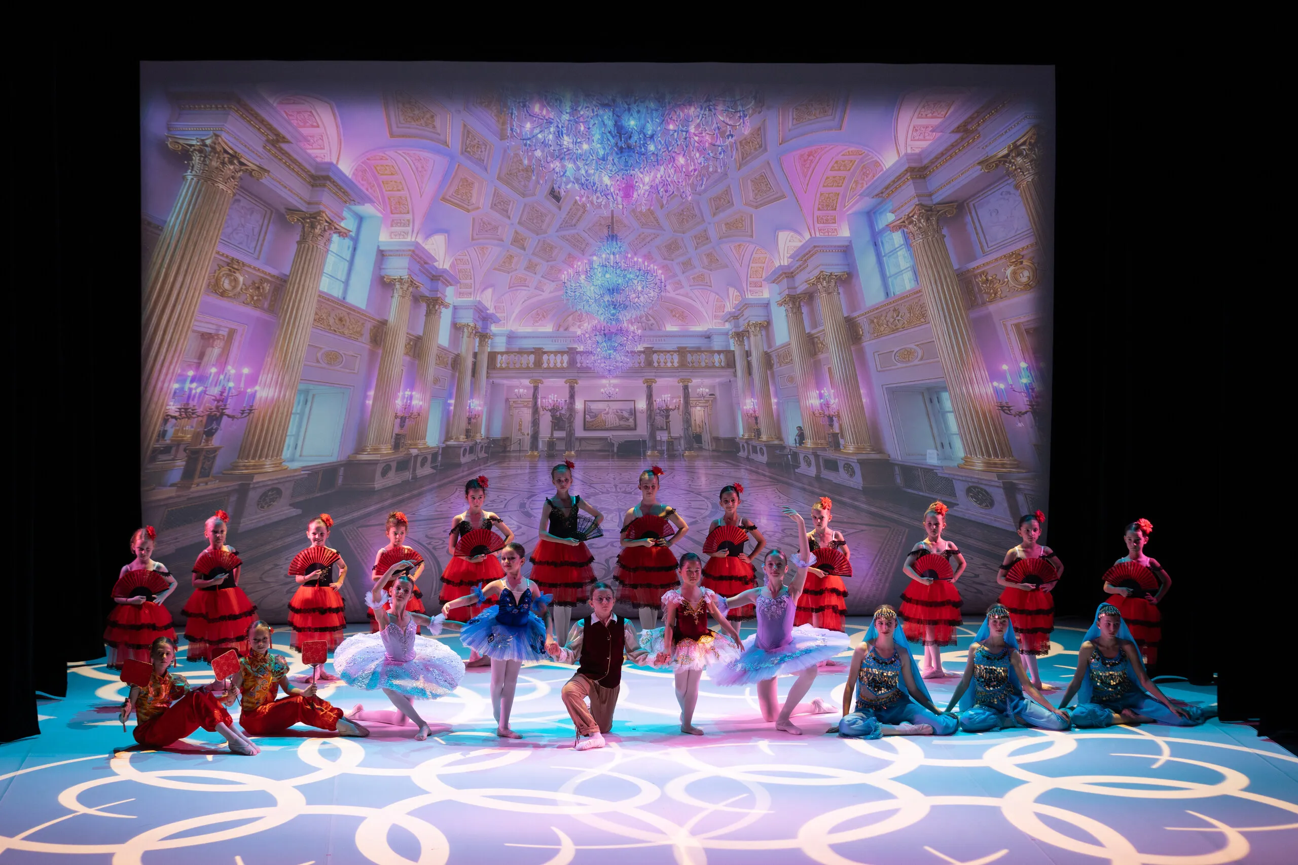 The divertissements gathered in a tableau on the palace stage.