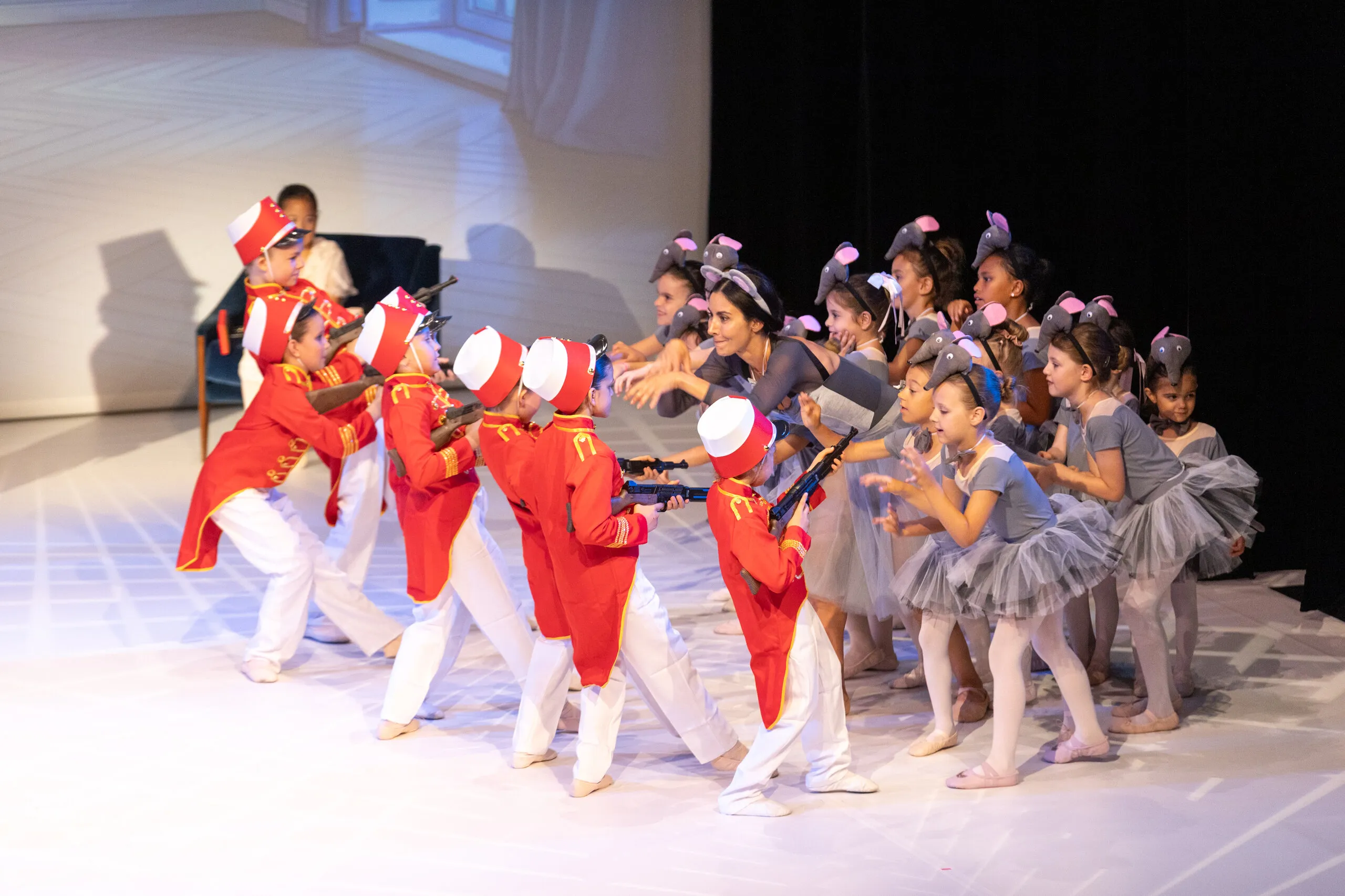 The battle, the soldiers in red facing the mice.