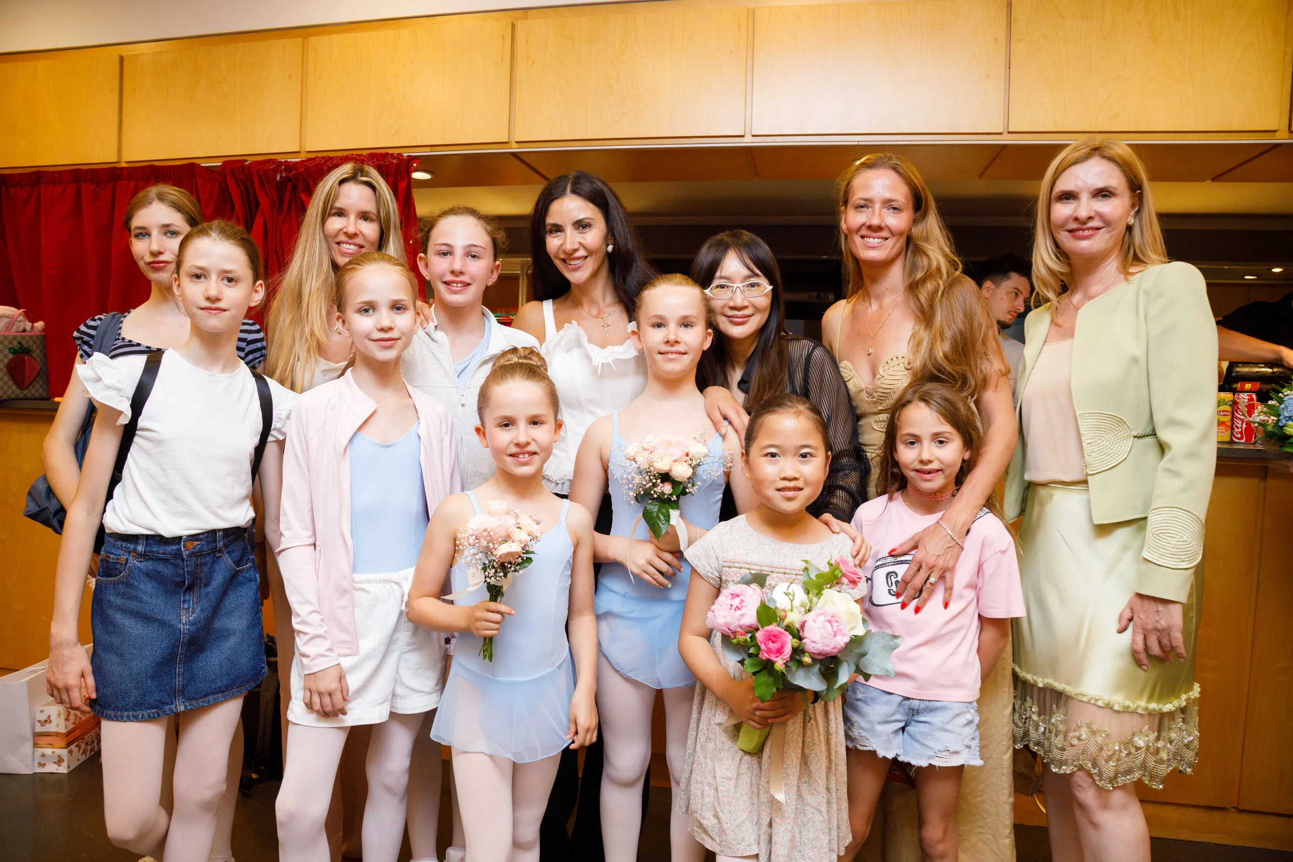 After the performance, students and their families in the theatre foyer.