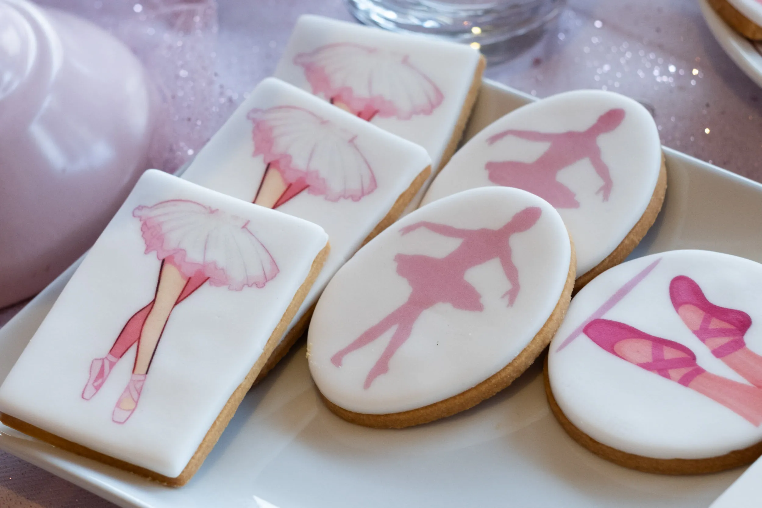 Iced biscuits with ballerina and pointe shoe silhouettes.